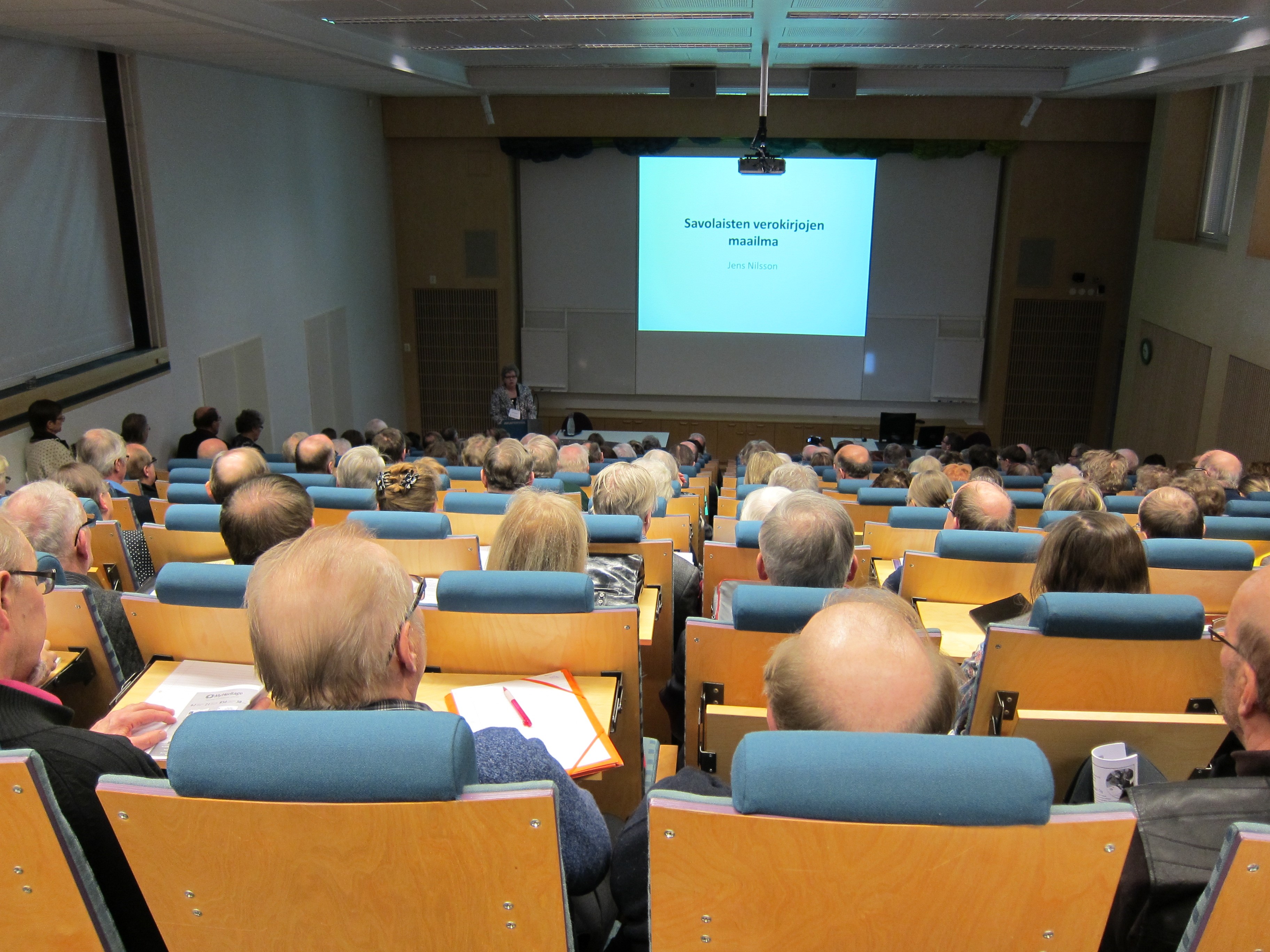 Åhörare i ett auditorium.