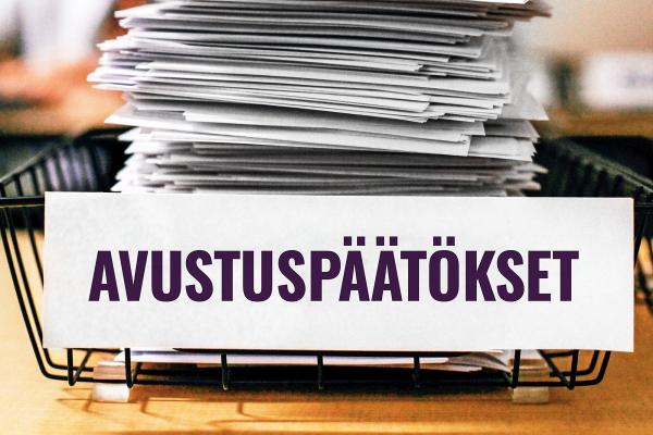 Kirjapino, jonka edessä teksti "avustuspäätökset".
